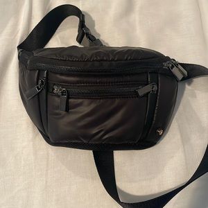 New without tags Caraa small black sling— can be worn as Fanny pack or crossbody